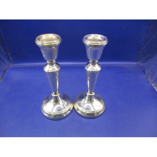 100 - A pair of vintage sterling silver candlesticks, approx. height 15cm, approx. gross weight 260g, in p... 