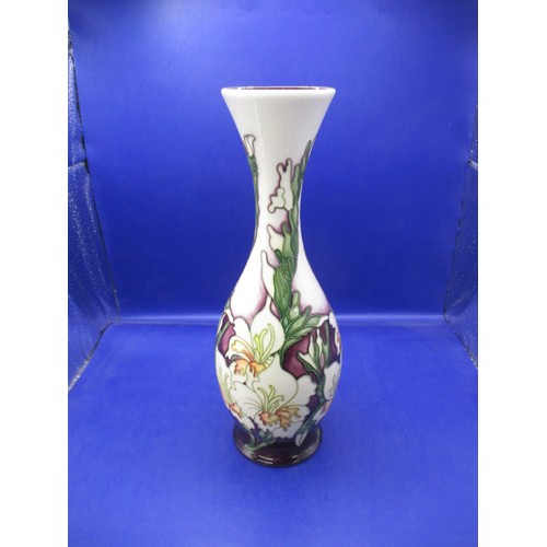 179 - A 2006 Moorcroft tube lined vase, approx. height 26cm in good pre-owned condition with no observed d... 