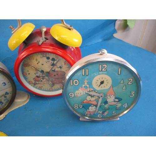 278 - Six vintage novelty alarm clocks, some with automaton dials, all run when wound, all with use relate... 