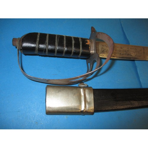 198 - Two vintage swords, one with a leather scabbard, approx. length of longest 89cm, the short sword is ... 