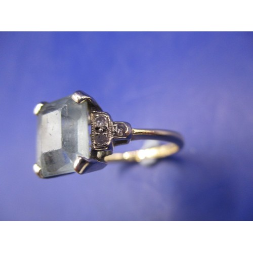 12 - A vintage 18ct yellow gold dress ring with central aquamarine and 3 diamonds to each shoulder, appro... 