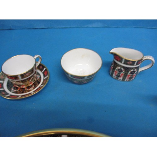 182 - A Royal Crown Derby miniature tea set on tray, in the 1128 pattern, all with same date numbers, in u... 