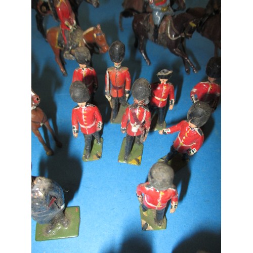 196 - A parcel of antique and later lead military figures, to include mounted examples, all in play worn c... 