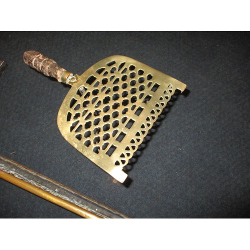 302 - A late 19th century brass fire fender and trivet, approx. width of fender 125cm in good used conditi... 