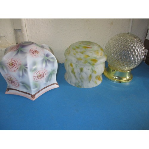 304 - Three vintage glass lamp shades, to include an art deco example, all in used condition with minor ch... 