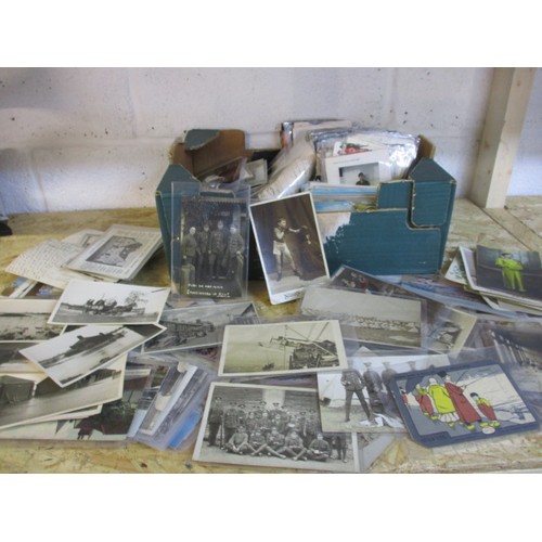 A large quantity of vintage postcards, to include military and topographical examples, all in used condition