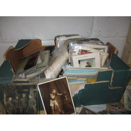 306 - A large quantity of vintage postcards, to include military and topographical examples, all in used c... 