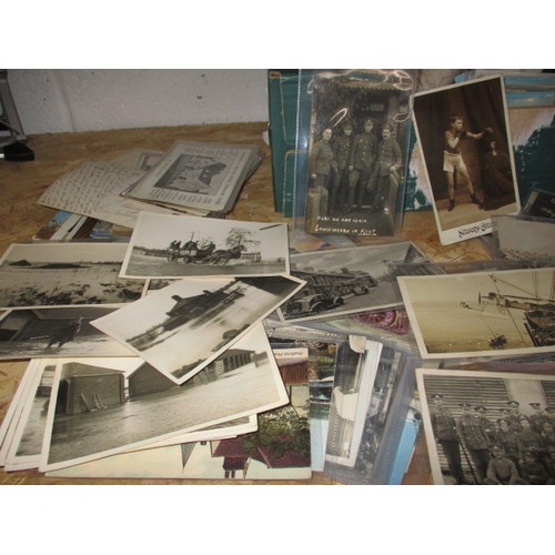 306 - A large quantity of vintage postcards, to include military and topographical examples, all in used c... 