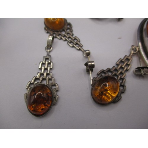 85 - A large butterscotch natural amber tear shaped pendant in white metal mount and a quantity of other ... 