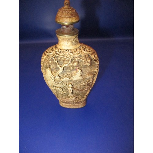 175 - An antique Chinese carved bone scent bottle, approx. height 8cm having intricate carving, having age... 