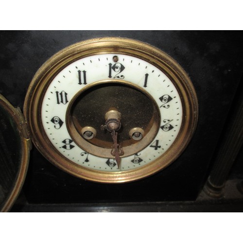 280 - A 19th century slate mantle clock with decorative Corinthian columns, having age-related marks and i... 