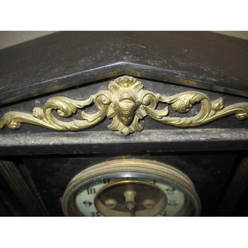 280 - A 19th century slate mantle clock with decorative Corinthian columns, having age-related marks and i... 