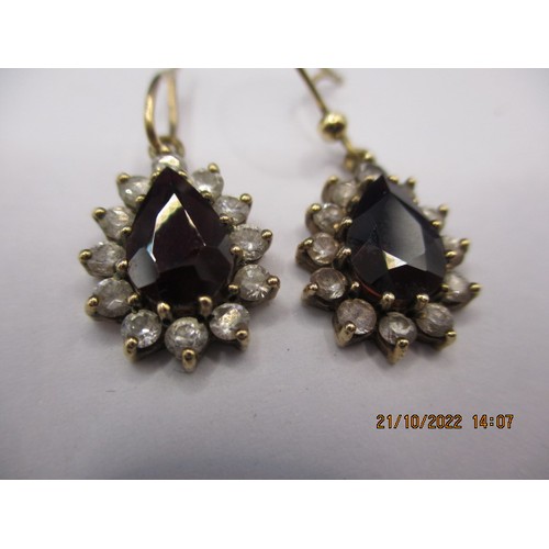 63 - Two pairs of earrings, one marked for gold the other yellow metal, having various types of stone, bo... 