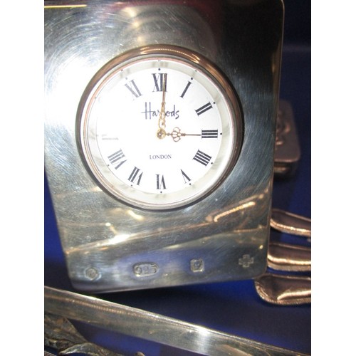 113 - A parcel of silver and white metal items to include a Harrods travel clock, all in used condition