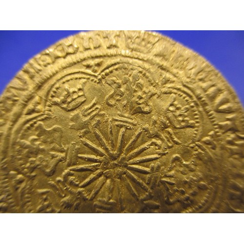 143 - An Edward IV gold rose Noble, London mint, type VII (1466-7) the obverse crowned king in ship with i... 