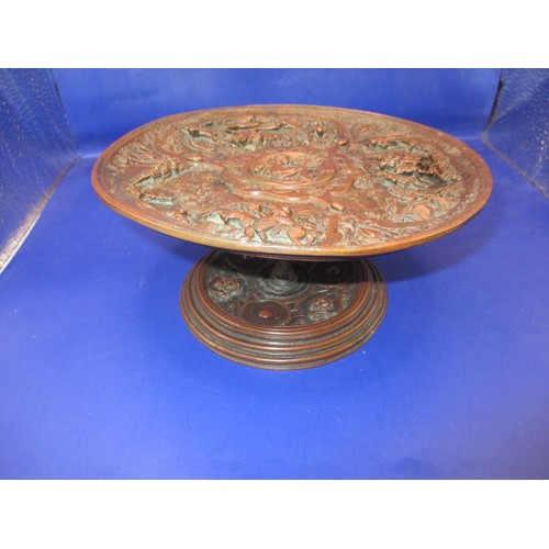 163 - A decorative bronzed metal pedestal Taza, having prolific cast and embossed decoration of royal hunt... 