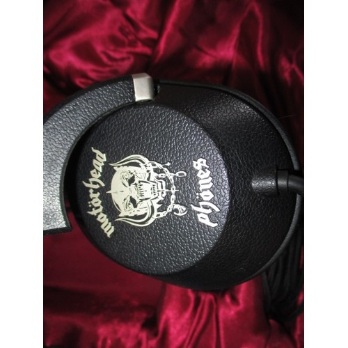 327 - An unused cased set of Motorhead head phones, a limited edition set no 97/100 with certificate and C... 