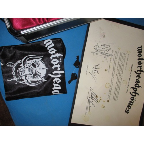 327 - An unused cased set of Motorhead head phones, a limited edition set no 97/100 with certificate and C... 