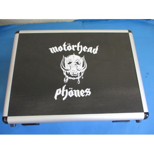 327 - An unused cased set of Motorhead head phones, a limited edition set no 97/100 with certificate and C... 