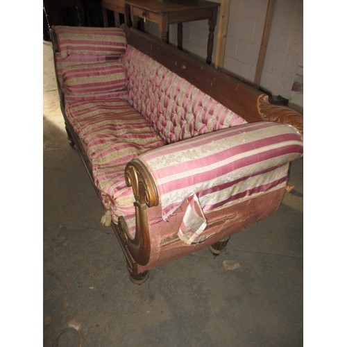 336 - A 19th Century upholstered sofa, with decorative scroll ends and show wood back. Approx. length 184c... 