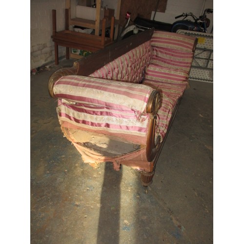 336 - A 19th Century upholstered sofa, with decorative scroll ends and show wood back. Approx. length 184c... 