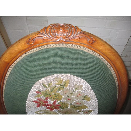 335 - A 19th Century walnut spoonback chair, with floral bead work upholstery and matching foot stool. In ... 