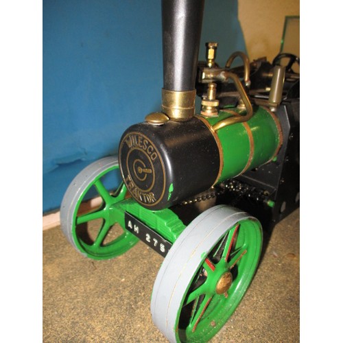 289 - A vintage Wilesco live steam tractor, in glazed display case, approx. length of model 28cm in used p... 