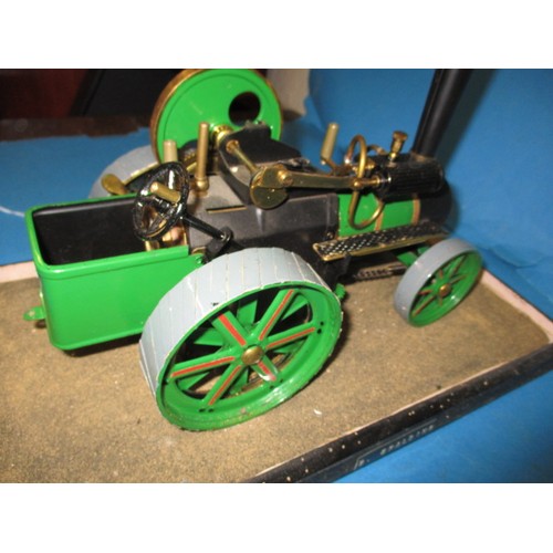 289 - A vintage Wilesco live steam tractor, in glazed display case, approx. length of model 28cm in used p... 