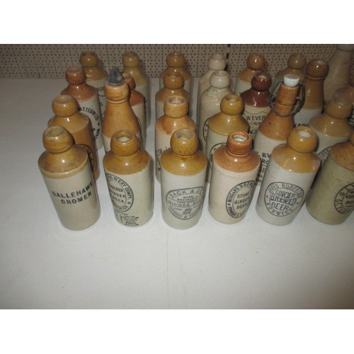 287 - 40 vintage stoneware ginger beer bottles, all with manufacturers names from Norfolk, some damages bu... 