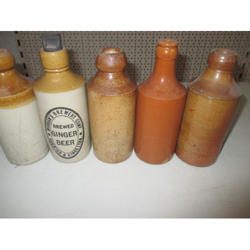 299 - 40 vintage stoneware ginger beer bottles, most with manufacturers names from Norfolk, some age relat... 