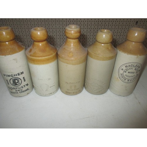 299 - 40 vintage stoneware ginger beer bottles, most with manufacturers names from Norfolk, some age relat... 