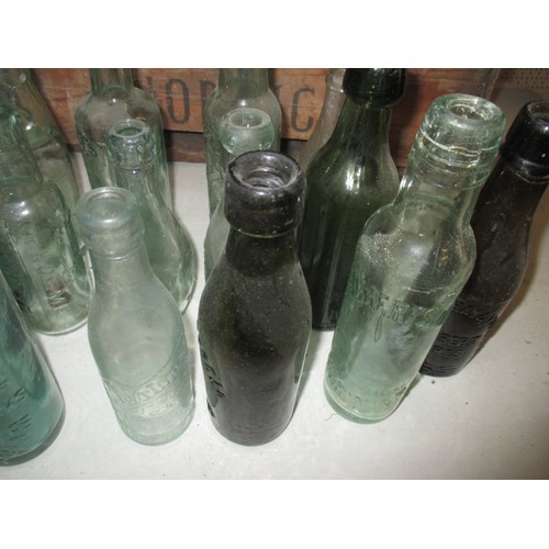 314 - Two wood crates full of vintage bottles, various sizes and makers, 48 bottles in total, all in used ... 