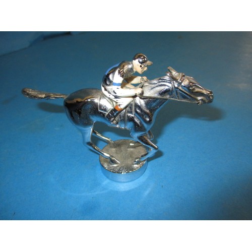 166 - A vintage chrome car mascot, in the form of a horse with jockey, chrome in good condition some ename... 