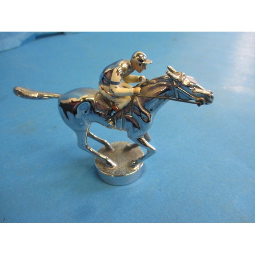 166 - A vintage chrome car mascot, in the form of a horse with jockey, chrome in good condition some ename... 