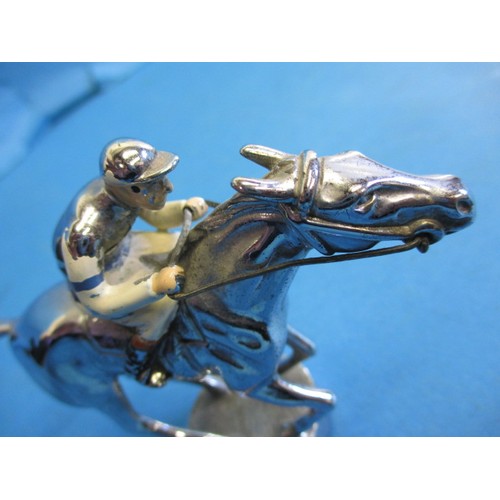 166 - A vintage chrome car mascot, in the form of a horse with jockey, chrome in good condition some ename... 