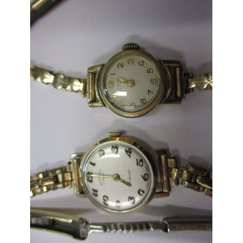 124 - A vintage 14k gold cased wrist watch and two other examples, none tested as to function and all with... 