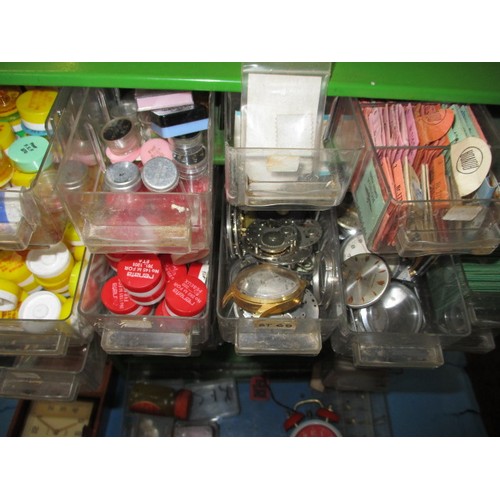 317 - A watch repairers cabinet with contents of parts and watches, all in used condition