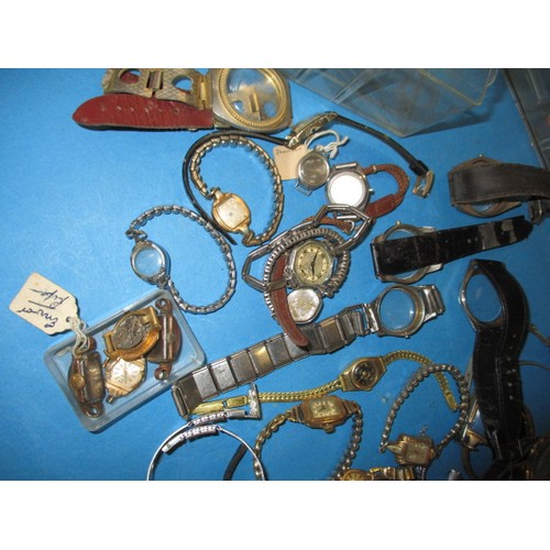 317 - A watch repairers cabinet with contents of parts and watches, all in used condition