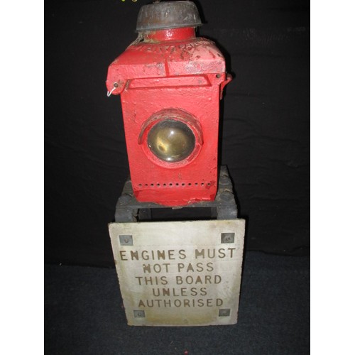 274 - An antique cast iron railway signal lamp on steel frame with aluminium sign “Engines must not pass t... 