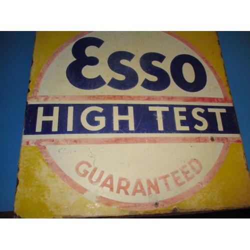 252 - A vintage double sided enamel advertising sign for Esso High Test Guaranteed, in good condition with... 