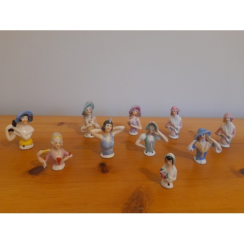 316 - A large quantity vintage half dolls, to include several art deco examples, all in pre-owned conditio... 