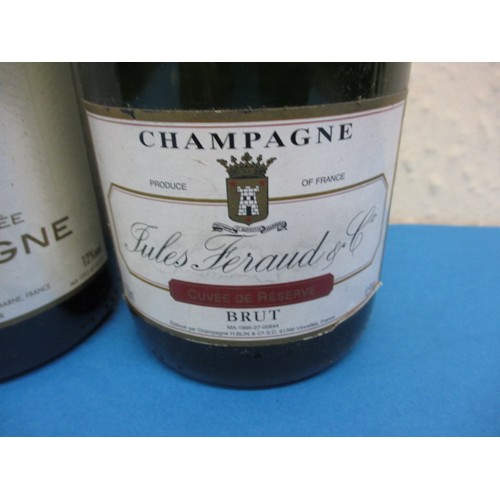 253 - Three bottles of Brut champagne, 2 by Jules Feraud & Co, all 750ml