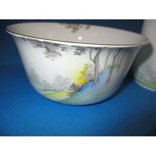 139 - A Shelly pottery cream jug and sugar bowl with tall trees and blue landscape, both in good condition... 