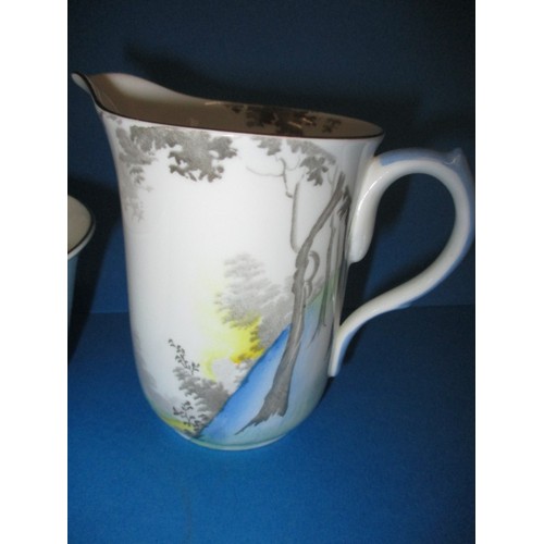 139 - A Shelly pottery cream jug and sugar bowl with tall trees and blue landscape, both in good condition... 