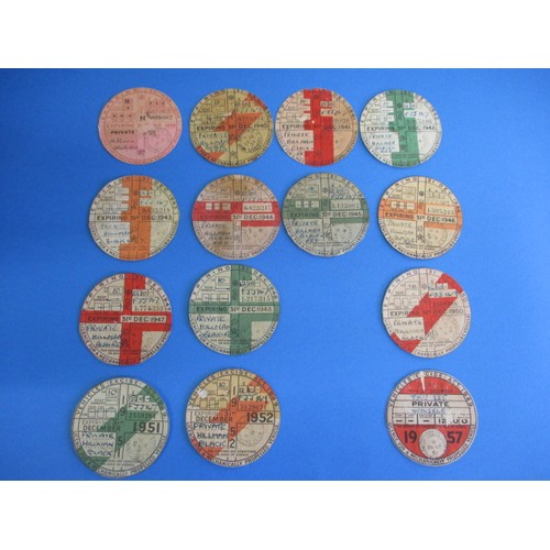 129 - A collection of vintage vehicle excise duty discs, (formally known as road tax) dating 1939 to 1952,... 