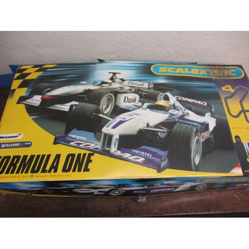 170 - A 1990s Scalextric F1 racing car set, in original box, cars having nose cones missing but in working... 