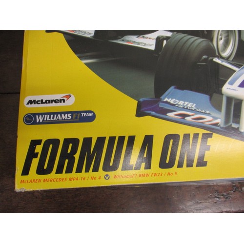 170 - A 1990s Scalextric F1 racing car set, in original box, cars having nose cones missing but in working... 