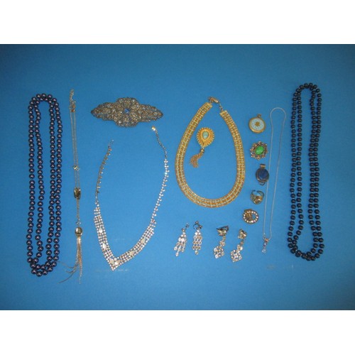 117 - A parcel of costume jewellery, to include a large brooch, in used condition with some missing stones