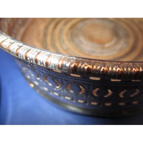 233 - A pair of silver plated bottle coasters, in used condition with some loss of plating and use-related... 