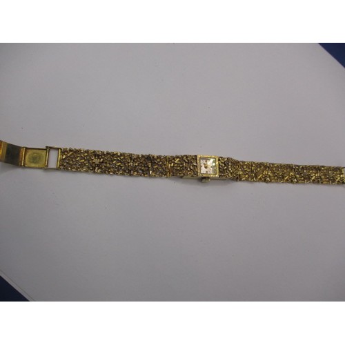 63 - A vintage gold cased and strapped ladies wrist watch, approx. gross weight 24.4g, not tested as to f... 